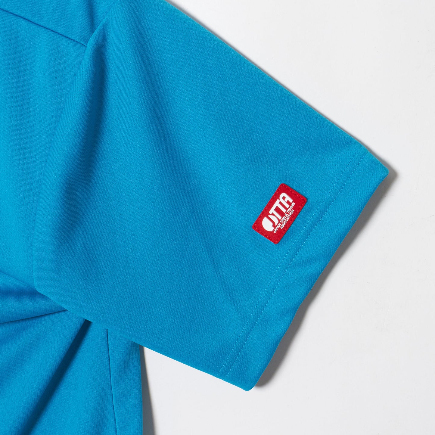 Rallys Tシャツ（ターコイズブルー・ロゴ小）｜公式戦でも使える卓球Tシャツ